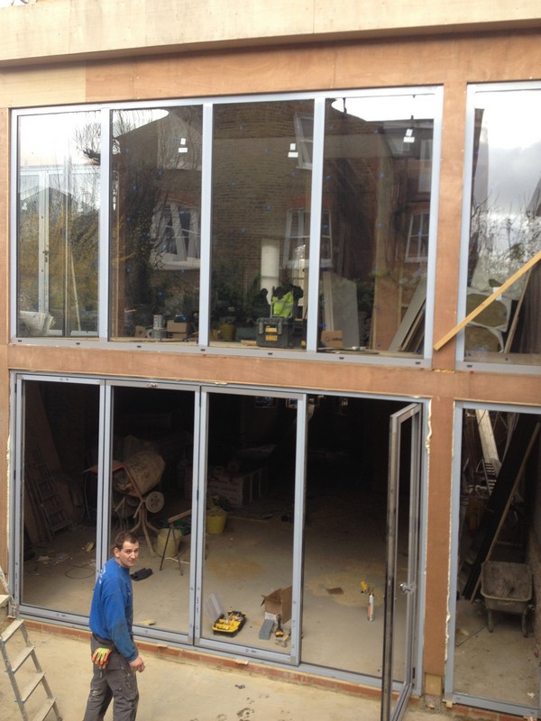 Aluminium bi-fold doors with two-storey glazing in Golders Green